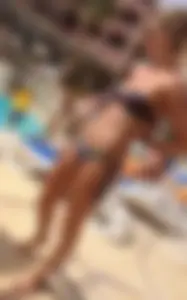 Sexy blonde babe in a bikini at the pool