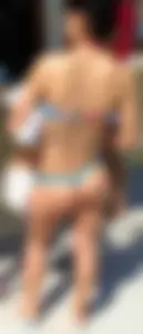 Milf ass on the beach in tiny blue thong
