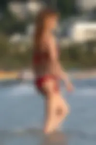 Skinny blonde babe in red bikini with camel toe and little pokies