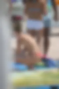 A bunch of sexy beach voyeur babes in bikinis, thongs and topless