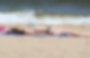 Two sexy beach teens in bikinis, one thick and one skinny with big boobs