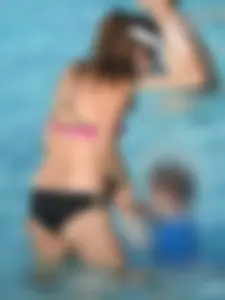 Asian milf in black and pink bikini at the beach