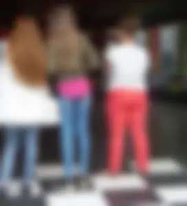 Skinny girl in tight blue jeans, long slim legs street creepshot