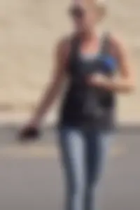 Skinny blonde in grey leggings with a friend