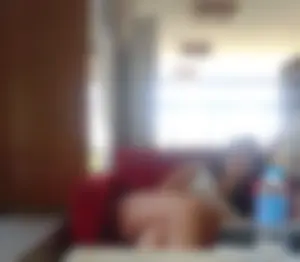 Girl Asleep With Crossed Legs on a Couch at the Library