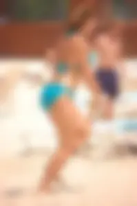 Assortment of sexy babes at the beach in bikinis