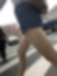 Young Girl in Shorts And Sandals Crossing the Street Gallery