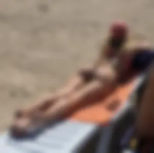 Group of hot candid girls laying on the beach creepshots