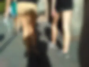 Brunette ass cheeks in short yellow shorts