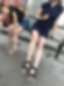 Very cute teen candid girl in a dress sitting on a bus stop creepshots