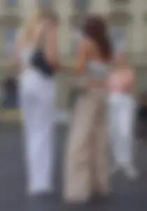 Long blonde braless in a white outfit (many pictures)