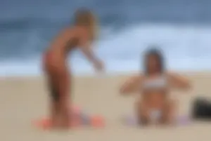 Sexy girls topless on a nude beach showing their nice tits