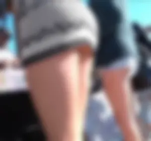 Sexy babe in a tiny skirt showing her ass and panties