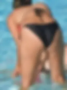 Sexy milf with a nice mom bod in a bikini in the pool