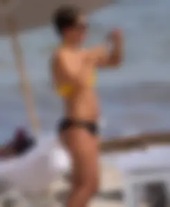 Frankie Bridge nip slips in a bikini on the beach