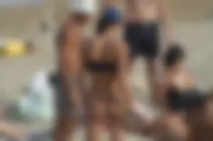 Topless girls on a beach in Barcelona