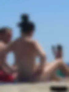 Purple thong topless lady on the beach gets oiled up by her husband
