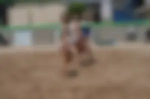 Beach volleyball blonde looking sexy and showing her body off