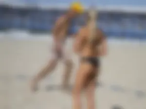 Hot candid girl playing beach volleyball in a swimsuit and sunglasses creepshots