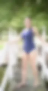Cute non-candid teen gymnast showing off her stretch on a pier