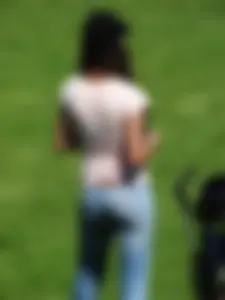 Skinny milf in tight jeans showing a bit of ass crack