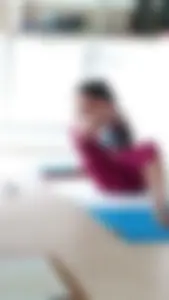 Sexy girlfriend doing yoga at home in leggings