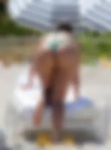 Chubby Candid Girl With A Hot Bubble Ass Bending Over a Sun-bed at a Beach Creepshots Gallery