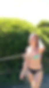 Adorable and sexy teen in colorful bikini at a water park