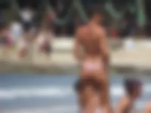 Girl with a great ass in thong bikini on the beach