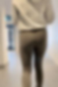Following the blonde with Fake lashes in green leggings