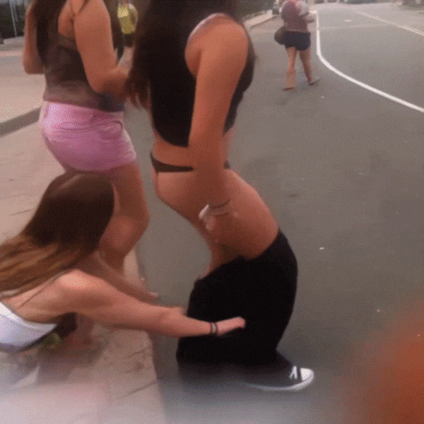 Teens fooling around on the street, pulling down pants