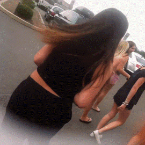 Teens fooling around on the street, pulling down pants
