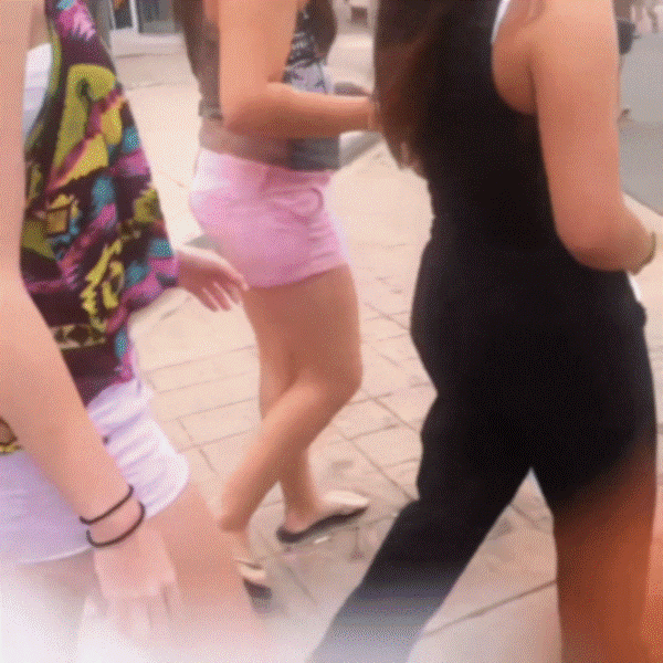 Teens fooling around on the street, pulling down pants