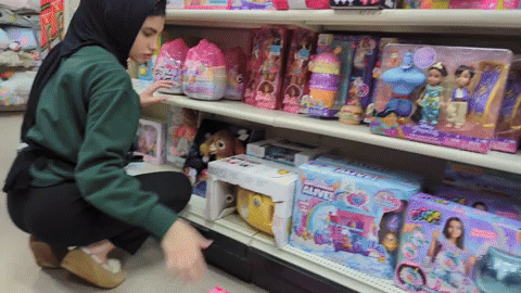 Hijab Princess stocking shelves @ department store