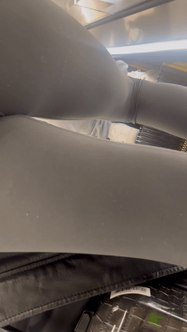 Tight curvy latina at airport pulls up pants