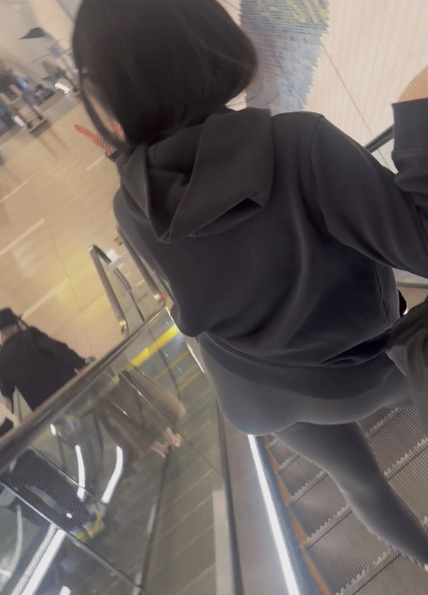 Tight curvy latina at airport pulls up pants
