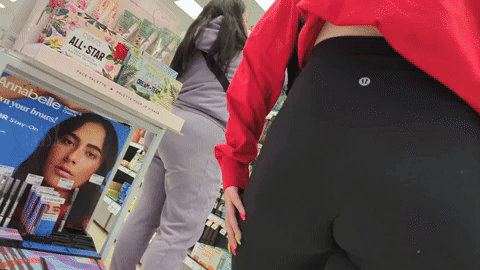 Nerdy brunette babe with friend in the beauty section