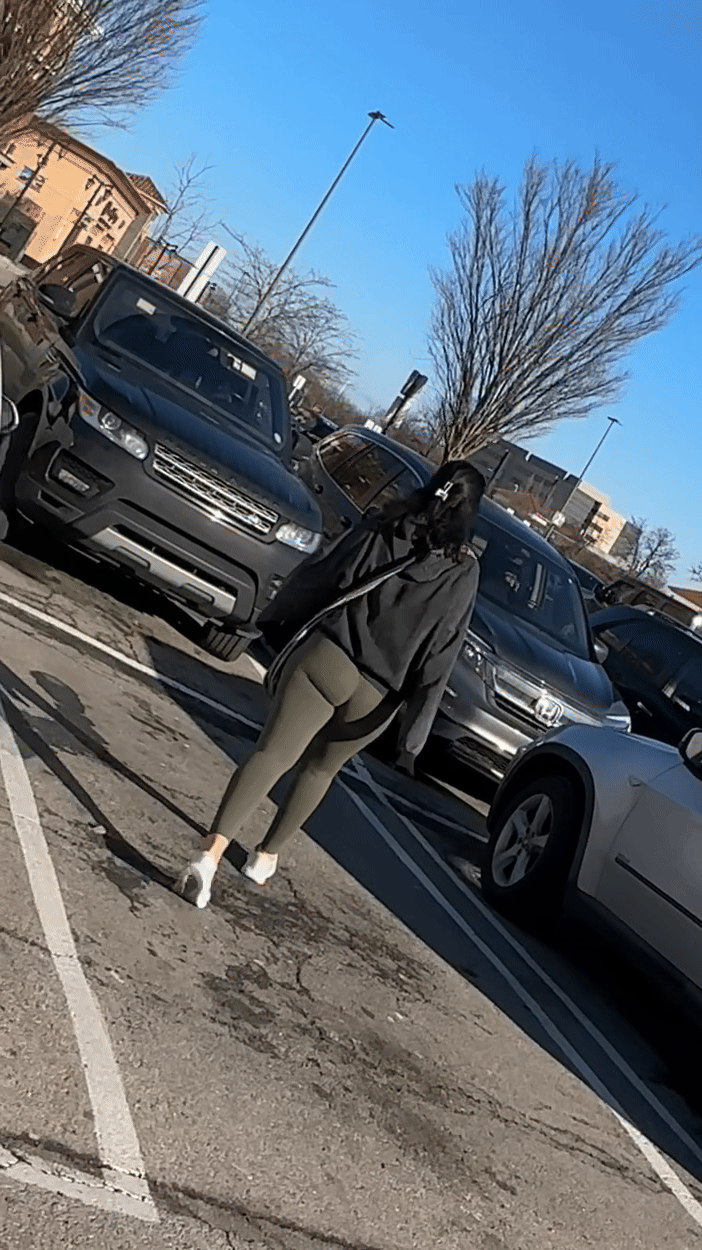 Sexy bubble butt in tight green leggings at the mall