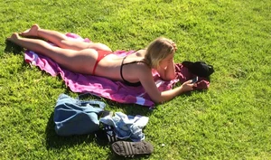 Candid Girl Lying on the Grass in Underwear