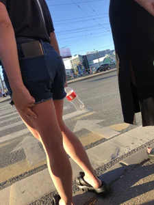 Cute candid teen wearing denim shorts crossing the street, awesome muscly legs
