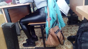 Young Candid Student in Tight Leather Pants in College Class