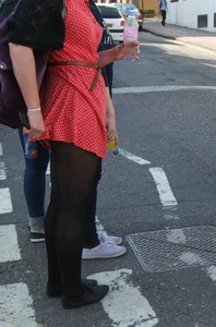 Girl in a pink skirt and stockings accidentally showing some cheek