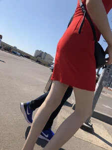 Girl in a Red Dress and Sandals With Thin, Pale Legs on the Crosswalk City Creepshots Gallery
