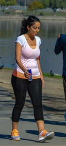 Thick lady walking in leggings with a big booty