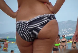 Sexy candid milf at the beach in a bikini with a sexy thick booty
