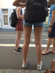 Girl with Skinny Hot Legs in Denim Mini Shorts with Rucksack City Candid
