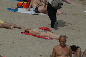 Topless girls on a beach in Barcelona