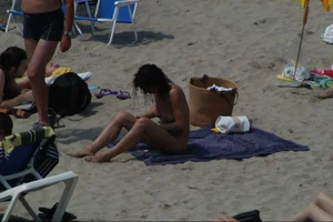 Girls on a nude beach in Sitges, Spain