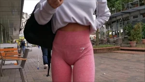 Beautiful strawberry blonde girl in pink leggings with a great booty