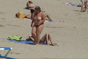 Girls on a nude beach in Sitges, Spain